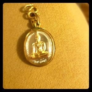 Reversible buddhas  necklace charm bought in thail